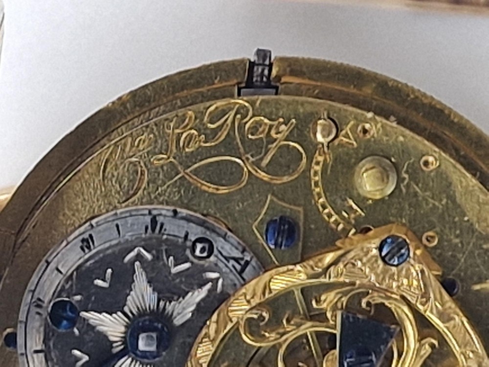 An eighteenth-century French gold quarter repeating pocket watch featuring a white enamel dial with Roman numerals, ornamental hands, and a jewel-encrusted bezel. View VII
