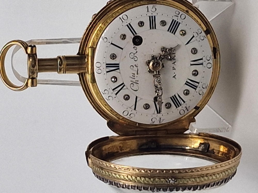 An eighteenth-century French gold quarter repeating pocket watch featuring a white enamel dial with Roman numerals, ornamental hands, and a jewel-encrusted bezel. View VIII