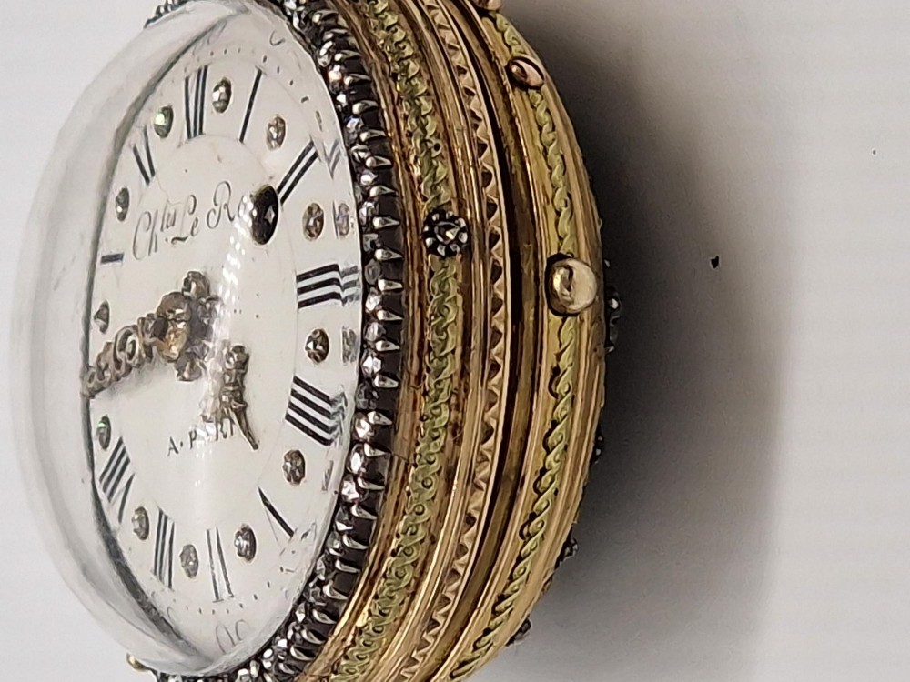 An eighteenth-century French gold quarter repeating pocket watch featuring a white enamel dial with Roman numerals, ornamental hands, and a jewel-encrusted bezel. View IX