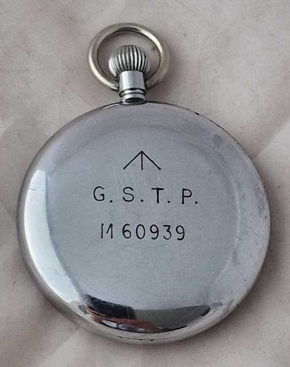 An open-face Cyma vintage pocket watch featuring a silver-coloured metal case, white dial, Arabic numerals, and a sub-seconds dial at six oclock. View II