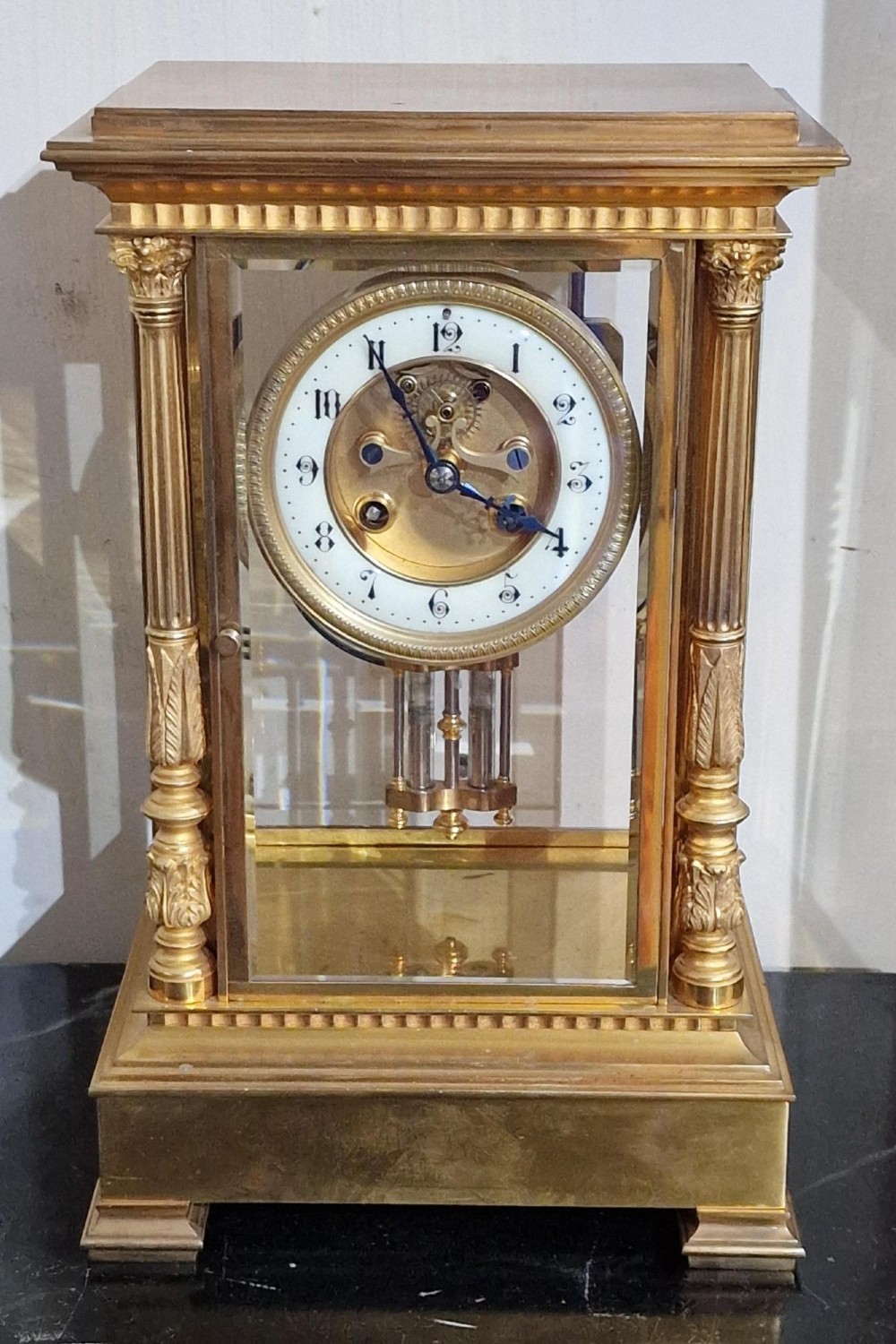 A Gilded Four Glass Mantel Clock