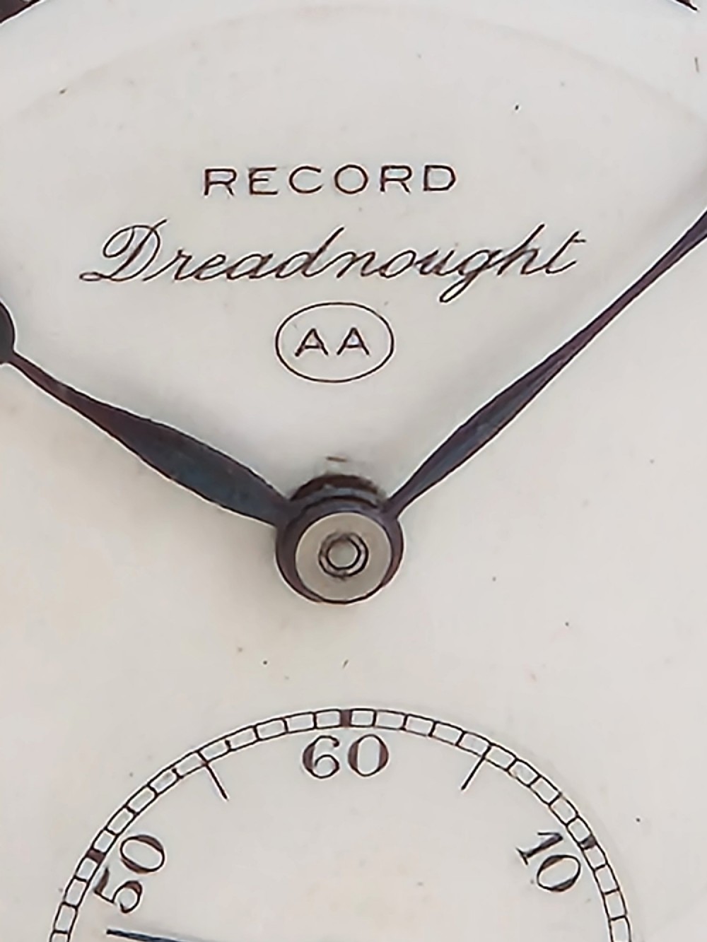 A gold full hunter pocket watch with an open outer case revealing a white enamel dial with black Roman numerals and a subsidiary seconds dial. View V