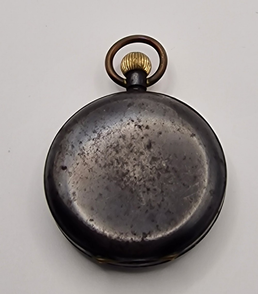 An open-face antique pocket watch with a white enamel dial, black Roman numerals, sub-seconds dial, and a silver metal case with a gold-toned crown. View II
