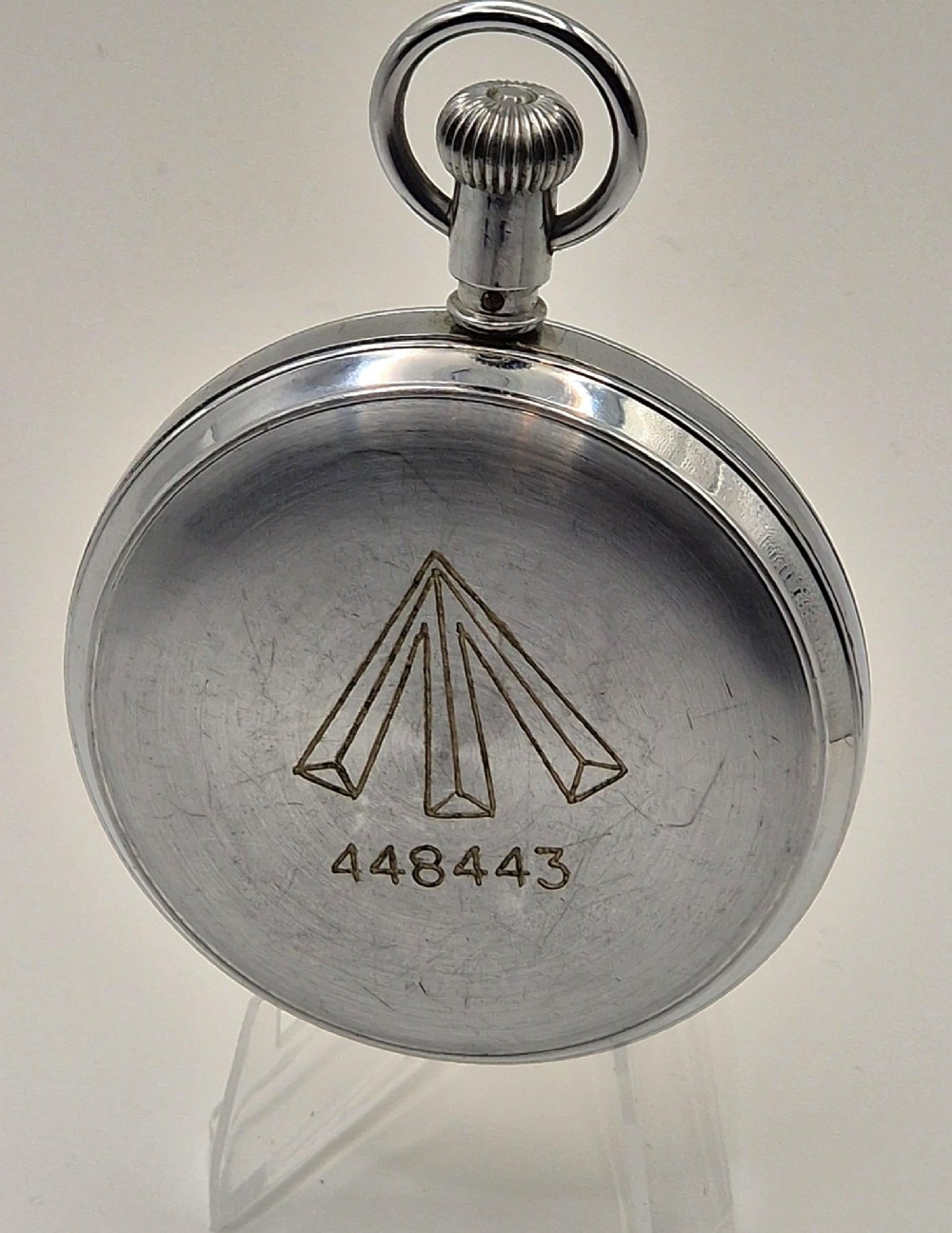 A Second World War era Royal Navy Waltham submarine stopwatch featuring a chrome-plated metal casing and a cream dial with red and black numerals. View II