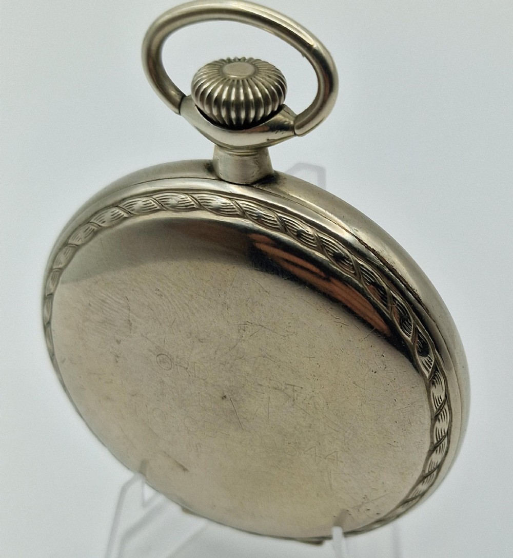 An open-face Elgin pocket watch with a white dial, black Arabic numerals, red outer minute markers, blued steel hands, and a silver-tone case. View II