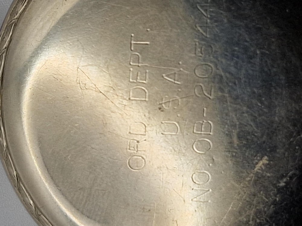 An open-face Elgin pocket watch with a white dial, black Arabic numerals, red outer minute markers, blued steel hands, and a silver-tone case. View IV