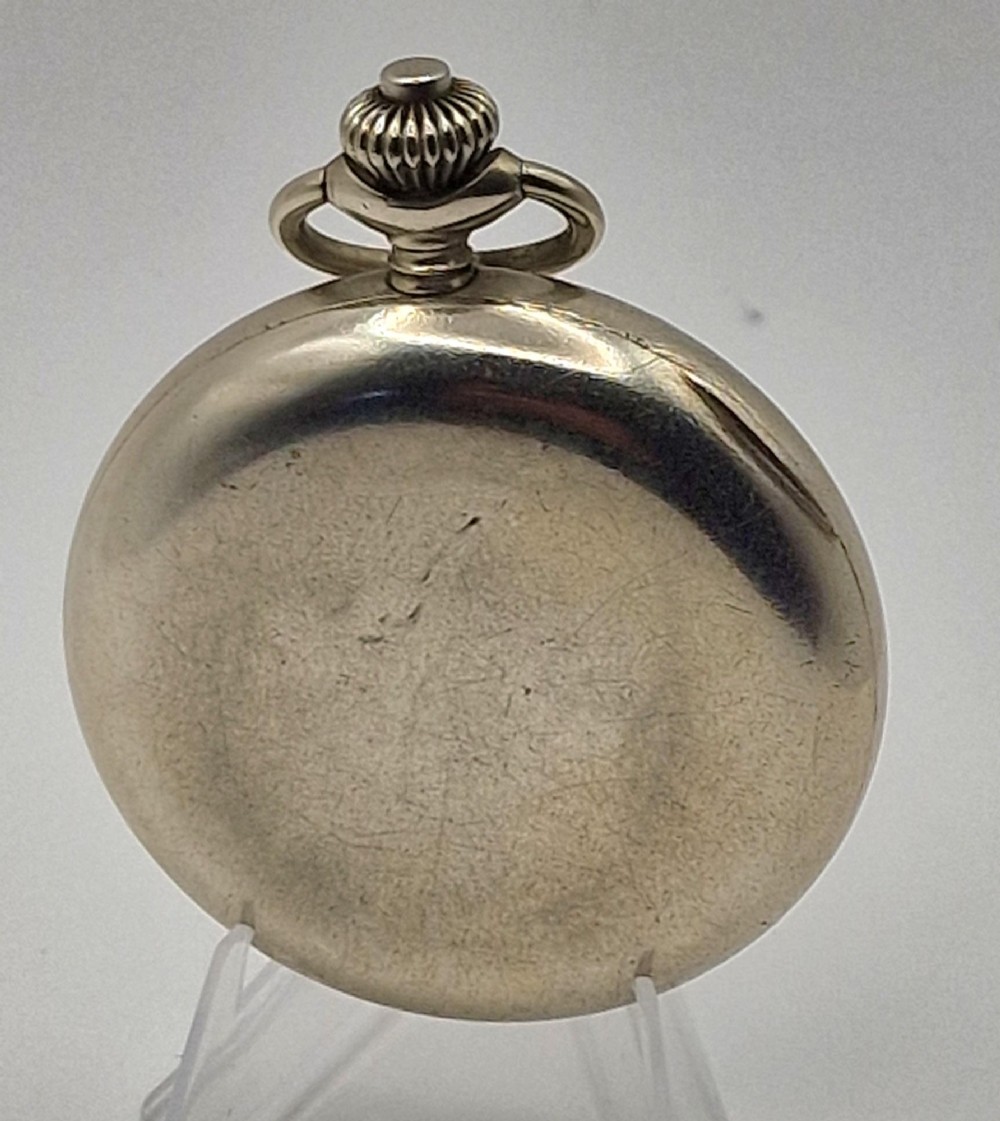 A vintage military chronograph pocket watch featuring a silver-tone metal case, a black dial with luminous Arabic numerals, two sub-dials, and an onion-style crown. View II