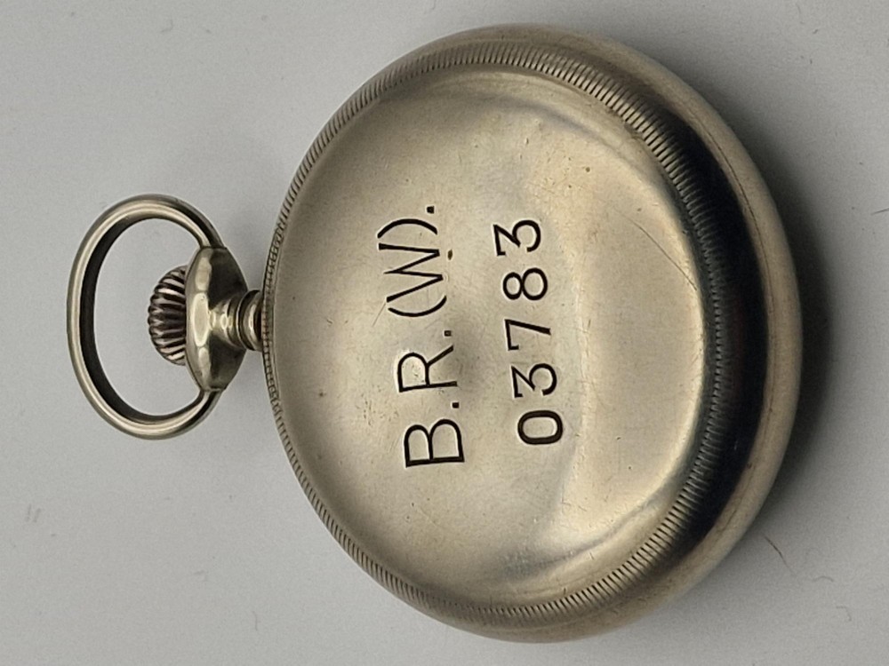 An open-face silver-toned railway pocket watch with a white dial, blued steel hands, Arabic numerals, and a small seconds sub-dial. View II