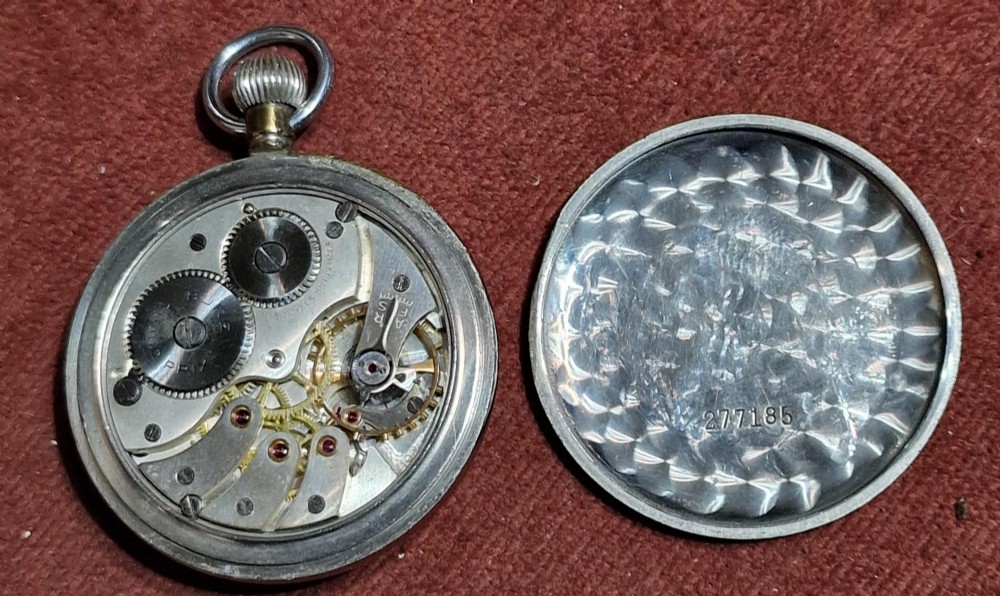 A vintage Buren Grand Prix Swiss pocket watch featuring a white dial, black Arabic numerals, luminous hands, a sub-seconds dial, and a silver-tone chrome case. View III