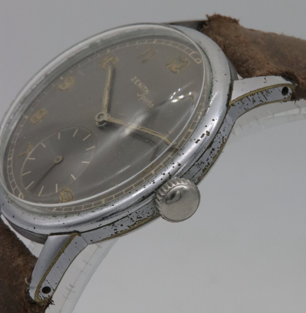 A 1950s Zenith Sporto mechanical wristwatch featuring a grey dial, Arabic numeral hour markers, a sub-seconds dial, and a brown leather strap. View III