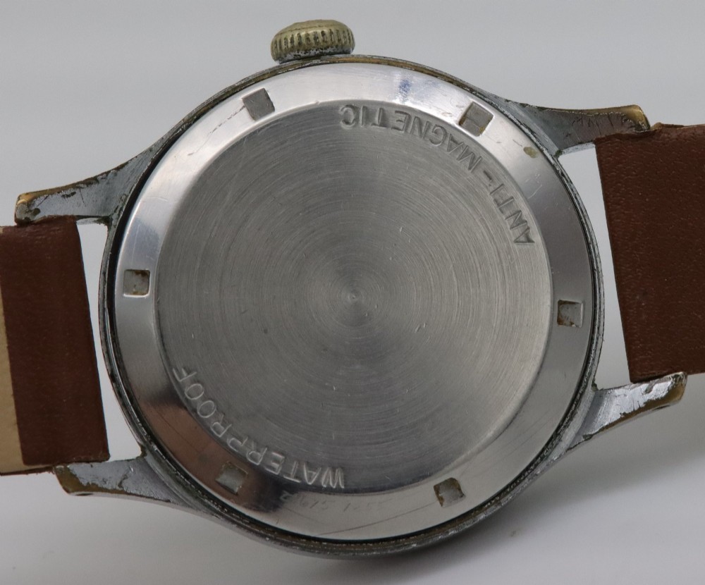 A 1950s J.W. Benson wristwatch featuring a black dial, gold-toned hands, a sub-seconds subdial at six oclock, a metallic case, and a smooth brown leather strap. View VI