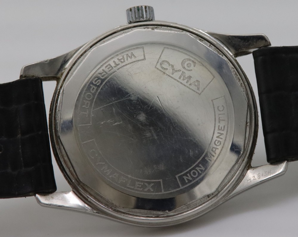 A 1950s Cyma Watersport Cymaflex wristwatch featuring a round stainless steel case, a black textured waffle dial with silver markers, and a black strap. View V