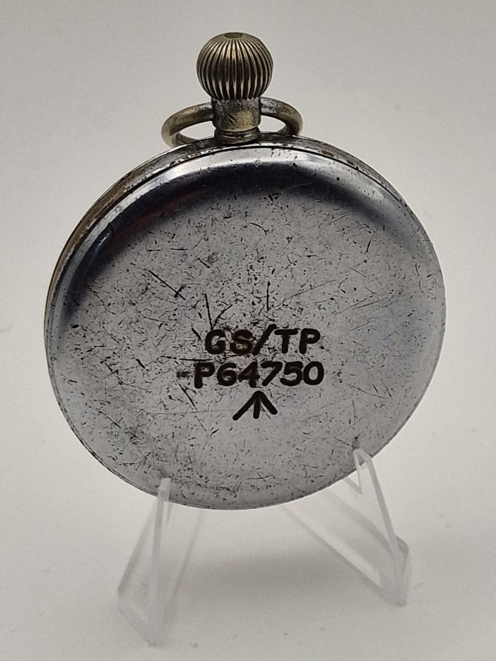 A round Helvetia military pocket watch featuring a white dial with bold black numbers, a sub-seconds dial, and a worn metal casing. View II