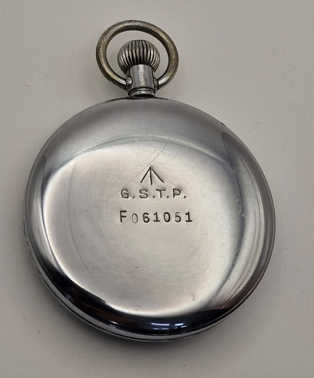 A vintage open-face military pocket watch featuring a silver-coloured metal casing, black dial with luminous Arabic numerals, and a sub-seconds dial at six oclock. View III