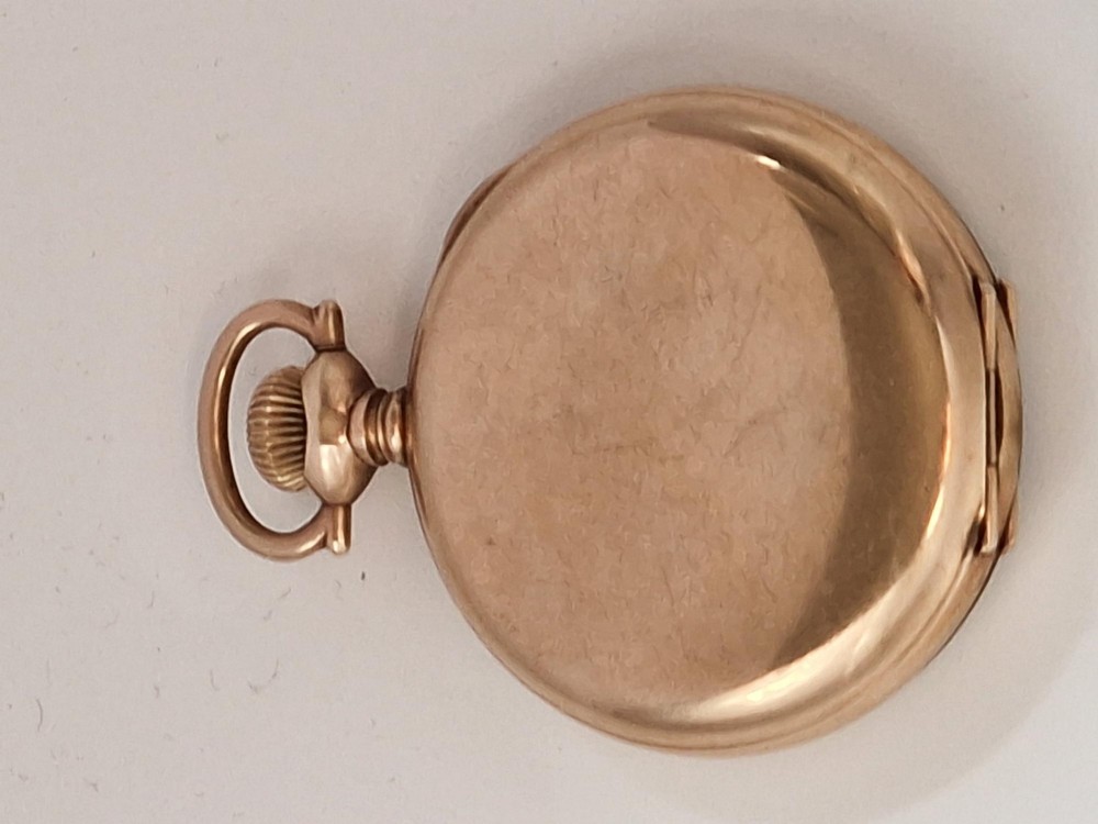 An antique gold-toned open-face pocket watch featuring a white enamel dial with black Roman numerals, blued steel hands, and a sub-seconds dial. View II