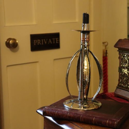 AN ARTS AND CRAFTS CANDLESTICK BY A J SEWARD BIRMINGHAM - ADDITIONAL PHOTO 6
