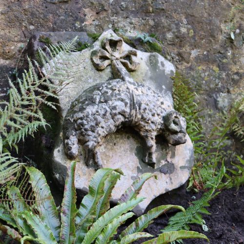 LARGE 19TH CENTURY POSSIBLY EARLIER SANDSTONE WALL PLAQUE DEPICTING A SHEEP SUSPENDED IN A RIBBON - ADDITIONAL PHOTO 1