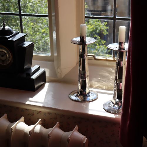 A PAIR OF ARTS AND CRAFTS SILVERED CANDLESTICKS - ADDITIONAL PHOTO 3
