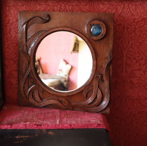 AN ARTS AND CRAFTS CARVED WOOD WALL MIRROR - ADDITIONAL PHOTO 2