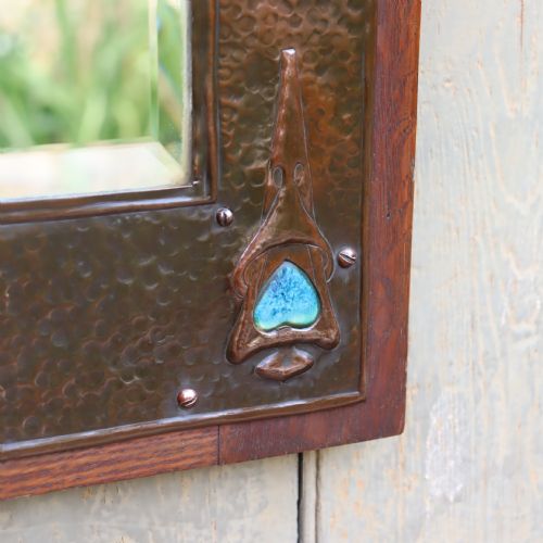 AN ARTS AND CRAFTS REPOUSS AND OAK FRAMED MIRROR - ADDITIONAL PHOTO 5