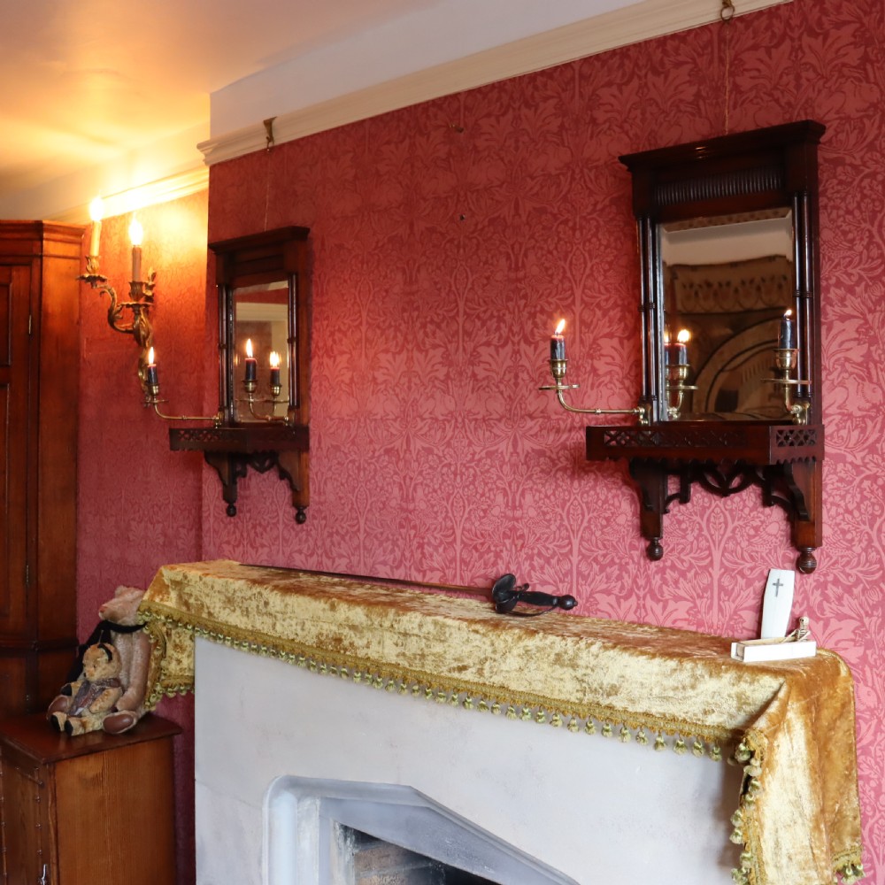 A pair of Victorian Walnut Girandole mirrors