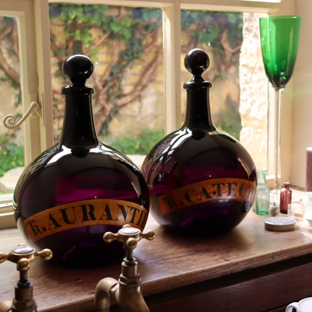 Rare Pair of 19th Century English Amethyst Glass Apothecary bottles