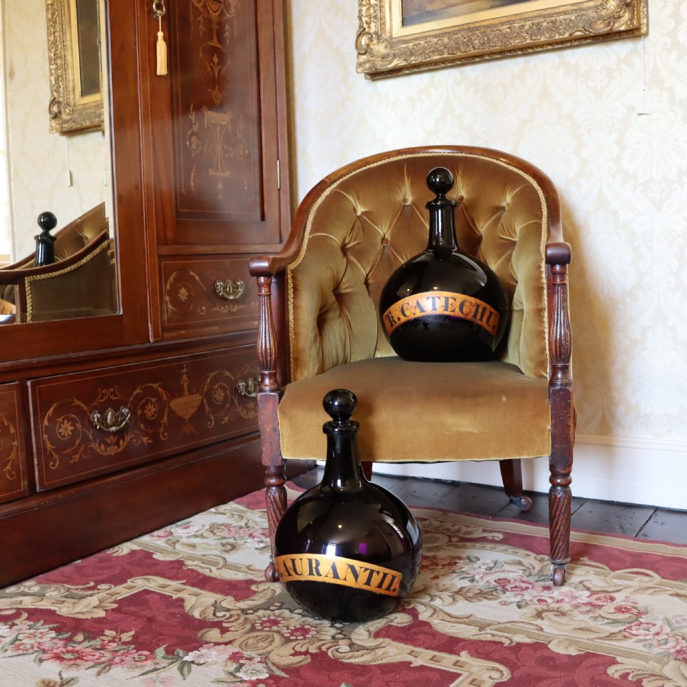 Rare Pair of 19th Century English Amethyst Glass Apothecary bottles View III