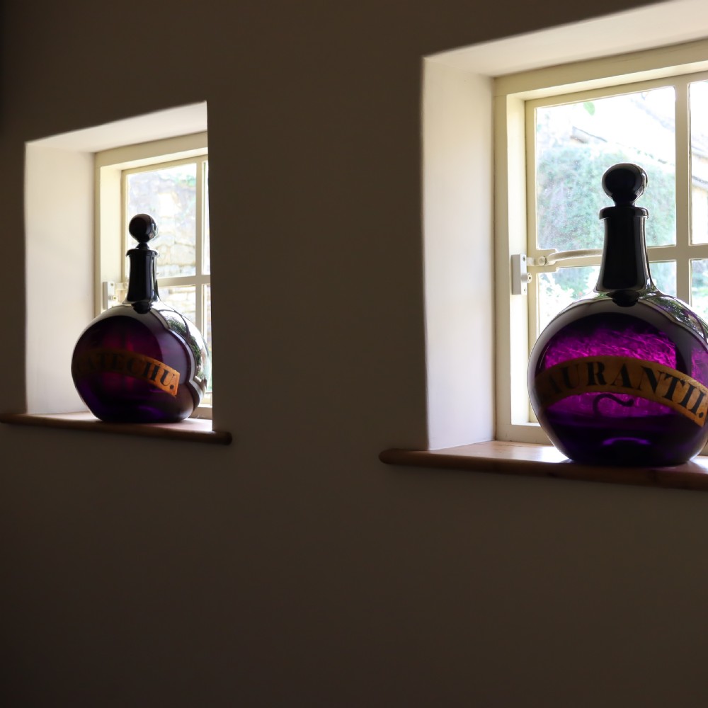 Rare Pair of 19th Century English Amethyst Glass Apothecary bottles View IV