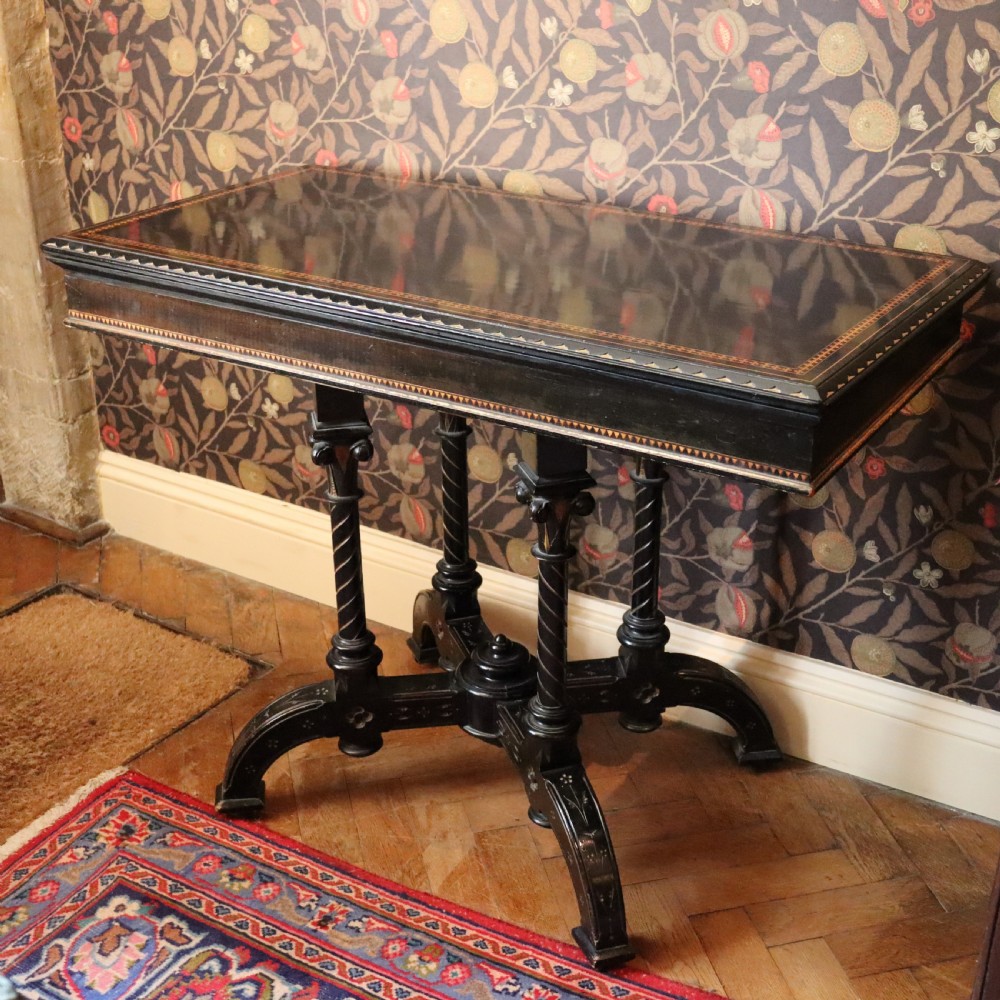 An Aesthetic Movement Ebonized and Inlaid Card Table