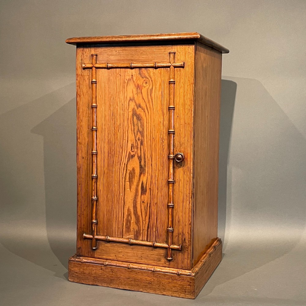A VICTORIAN HOWARD & SONS PINE PEDESTAL CUPBOARD