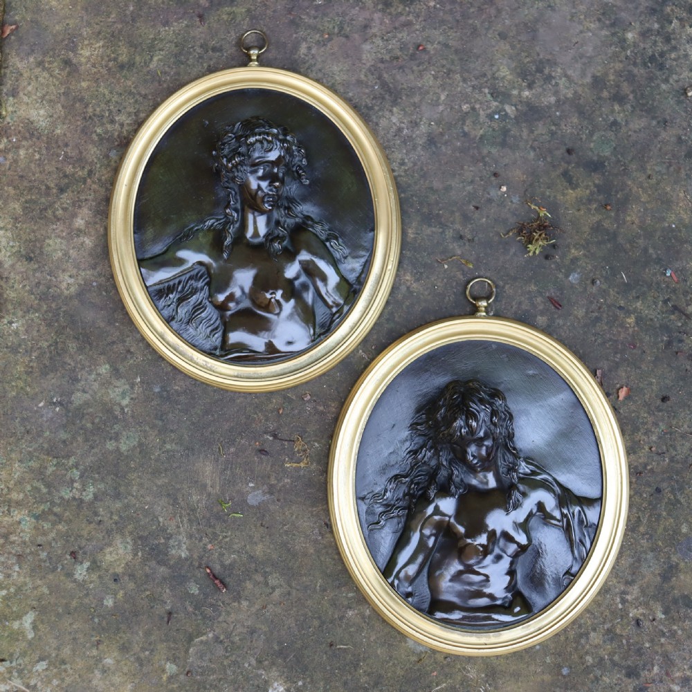 A pair of 19th Century Bronze oval reliefs of Bacchantes 