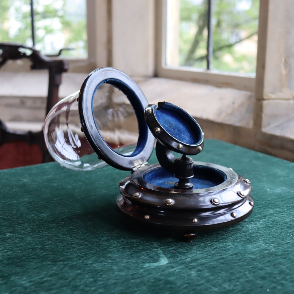 Glass dome on ebonised base Pocket watch holder