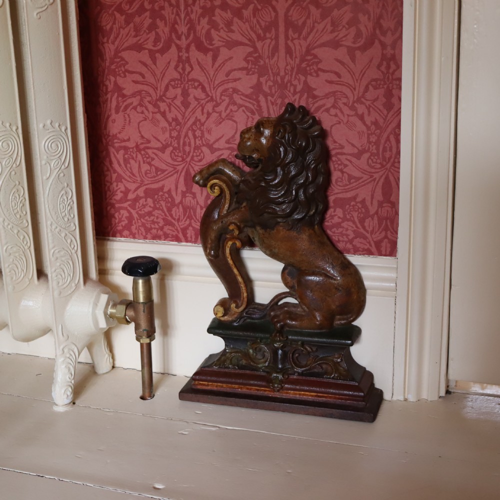 A Victorian cast iron Rampant lion doorstop 