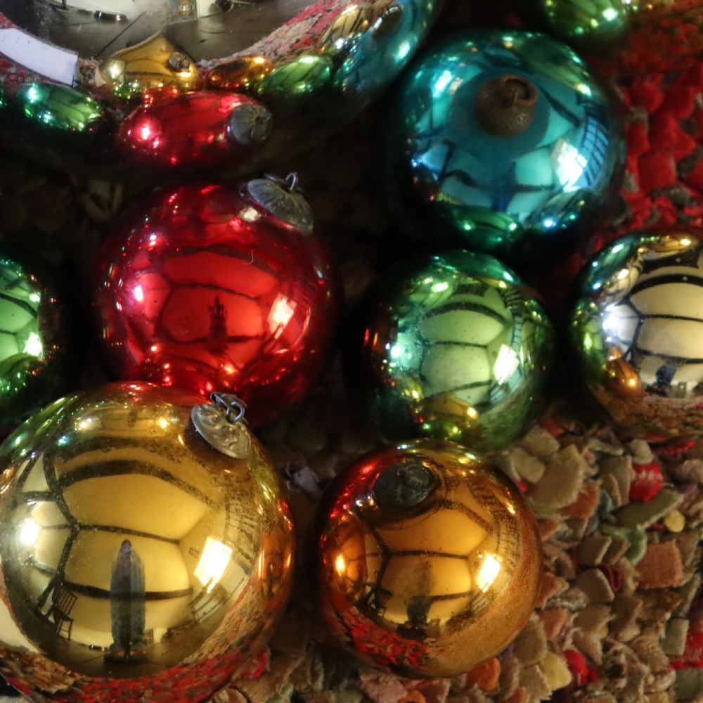 A collection of fifteen antique blown glass witches balls in varying sizes and reflective metallic colours including silver, gold, blue, green, and red. View IV