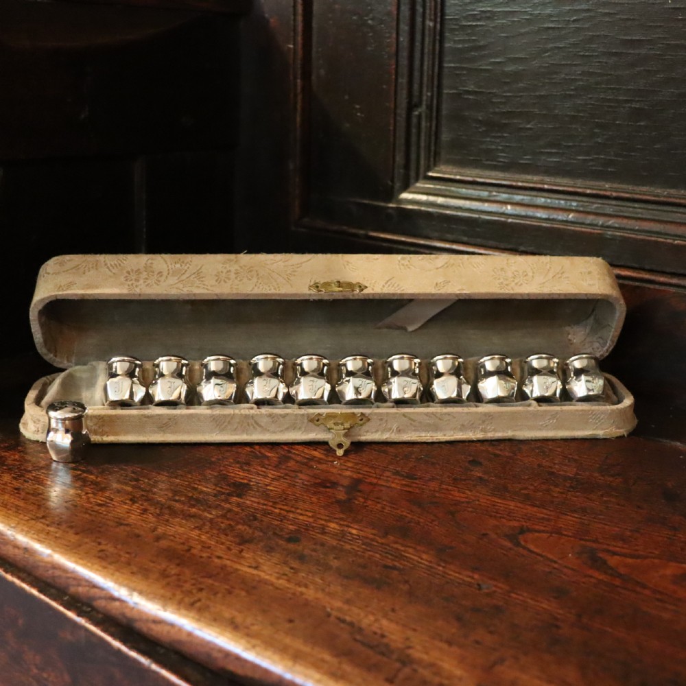 A full set of a dozen Victorian silver Pepperettes 