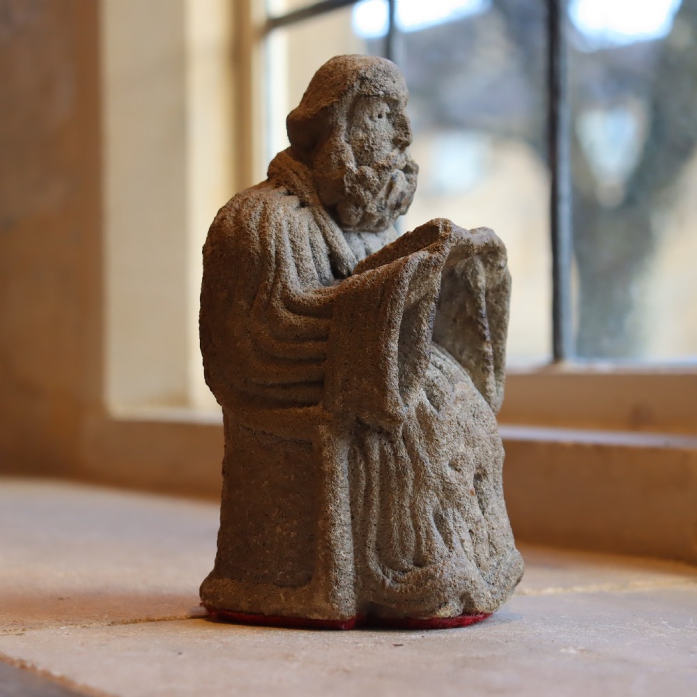 Post medieval carved limestone priest 