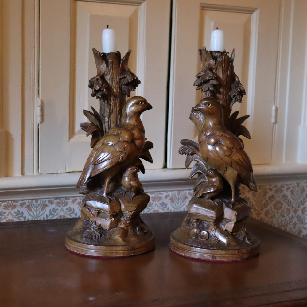 A pair of Black Forrest carved limewood candlesticks Circa 1880