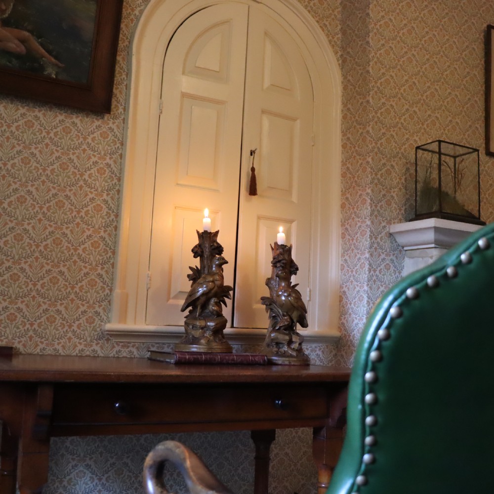 A pair of Black Forrest carved limewood candlesticks Circa 1880 View IV