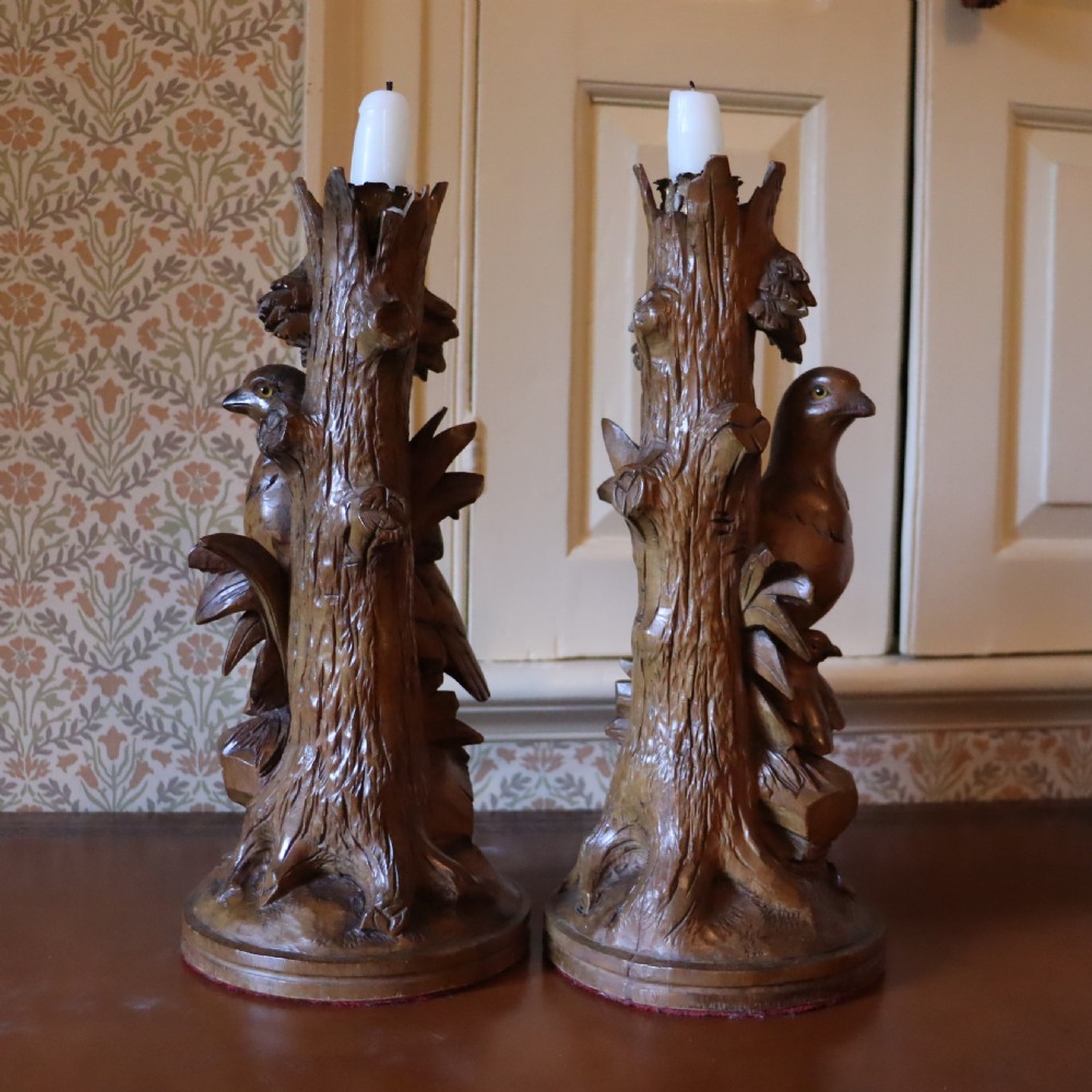 A pair of Black Forrest carved limewood candlesticks Circa 1880 View VII