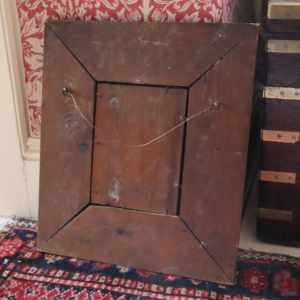 An Arts and Crafts copper repoussé wall mirror  View III