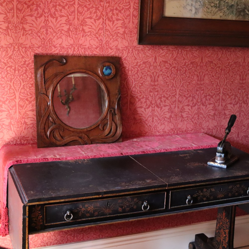 An Arts and Crafts carved wood wall mirror  View V