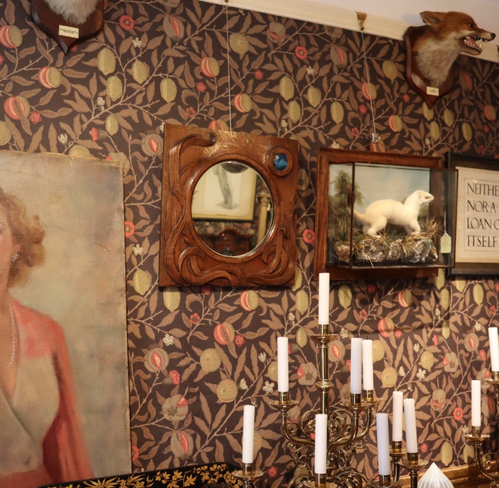 An Arts and Crafts carved wood wall mirror  View VI