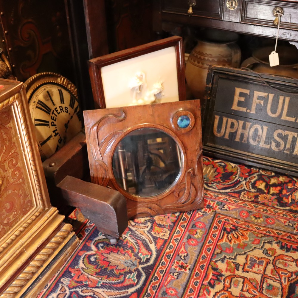 An Arts and Crafts carved wood wall mirror  View VII