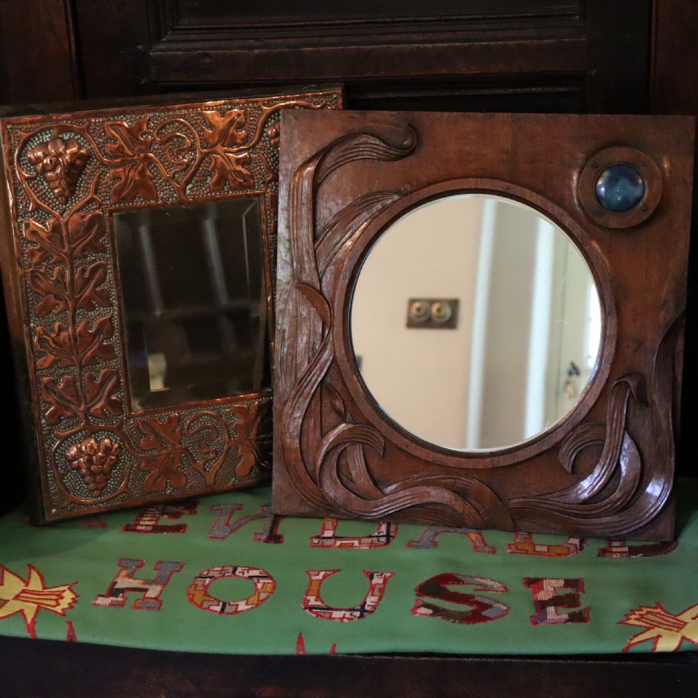 An Arts and Crafts carved wood wall mirror  View VIII
