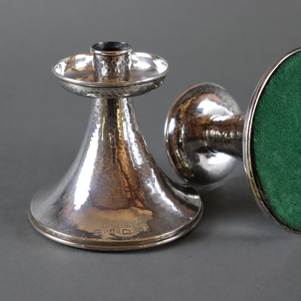 A fine pair of A.E.JONES Arts & Crafts silver candlesticks View II