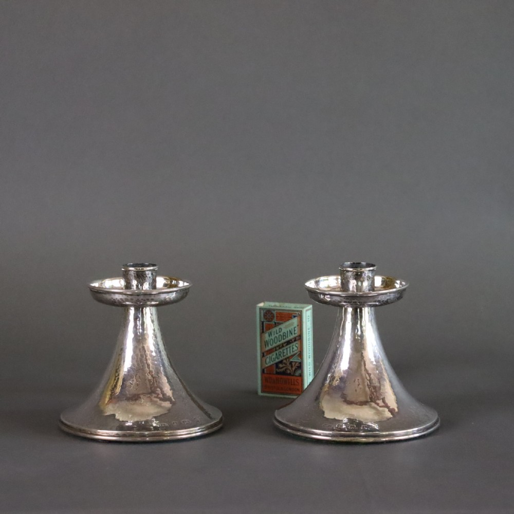 A fine pair of A.E.JONES Arts & Crafts silver candlesticks View III