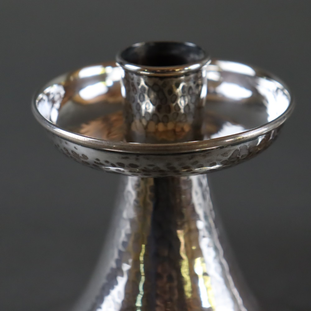 A fine pair of A.E.JONES Arts & Crafts silver candlesticks View IV