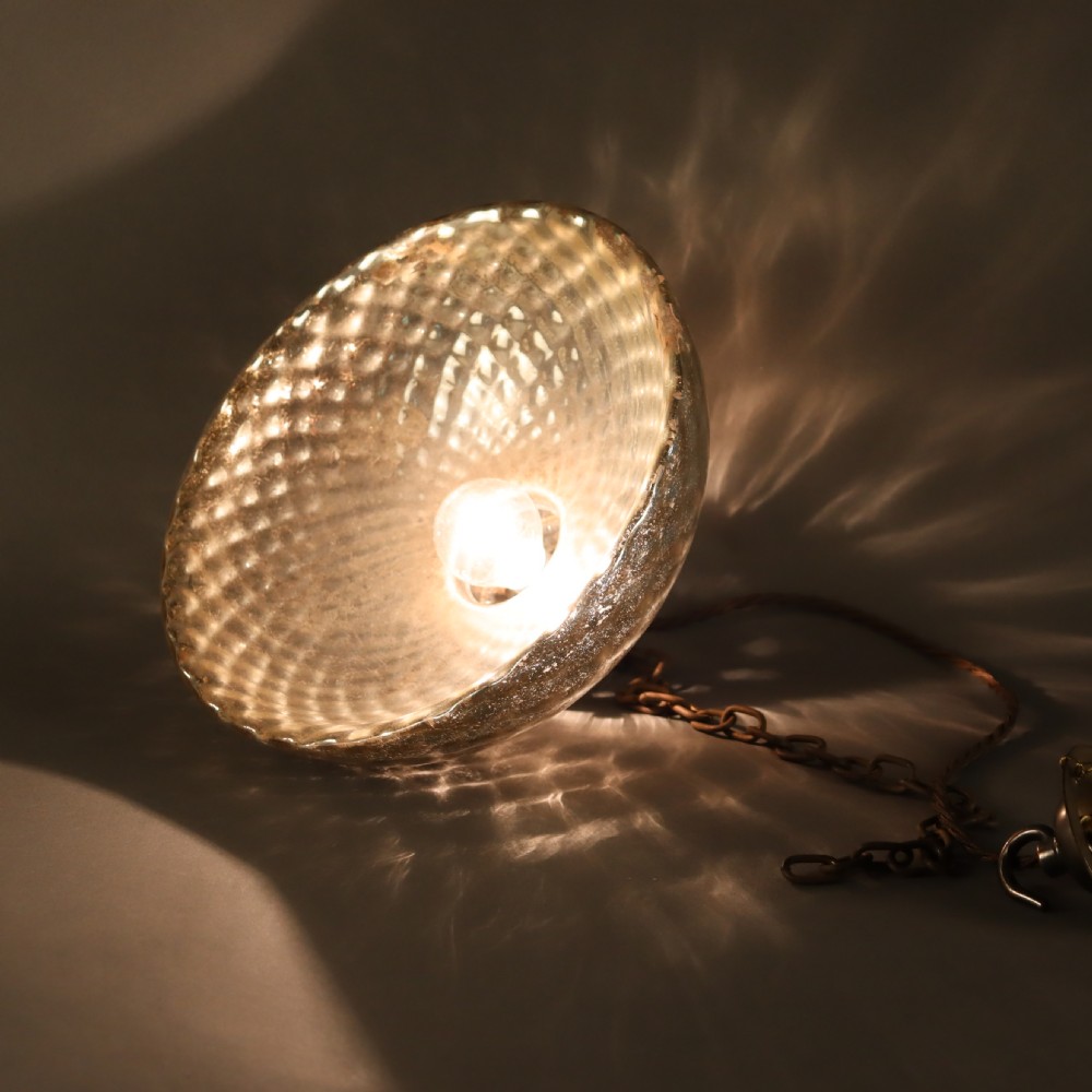A dome-shaped mercury glass pendant light shade with a dappled silvered interior finish and aged brass fittings. View IV