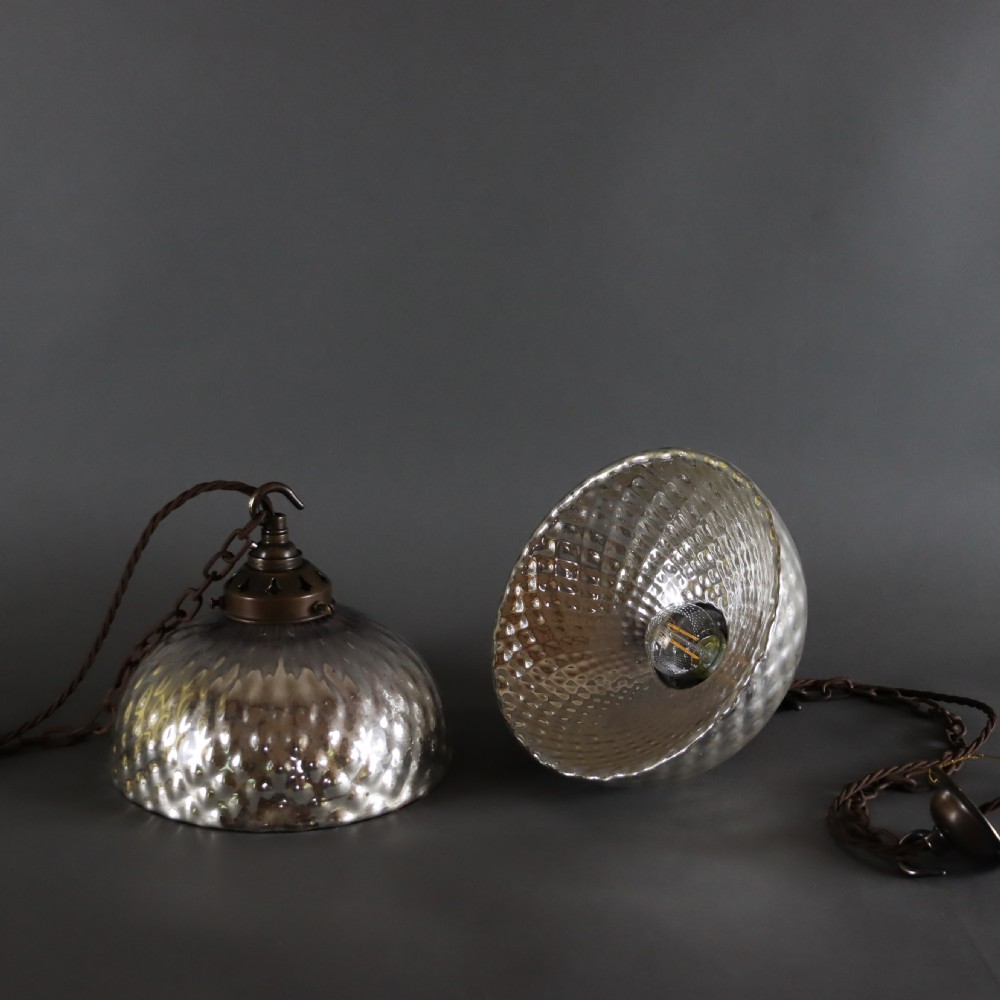 Pair of mercury mirrored glass pendant lights.  Circa 1920