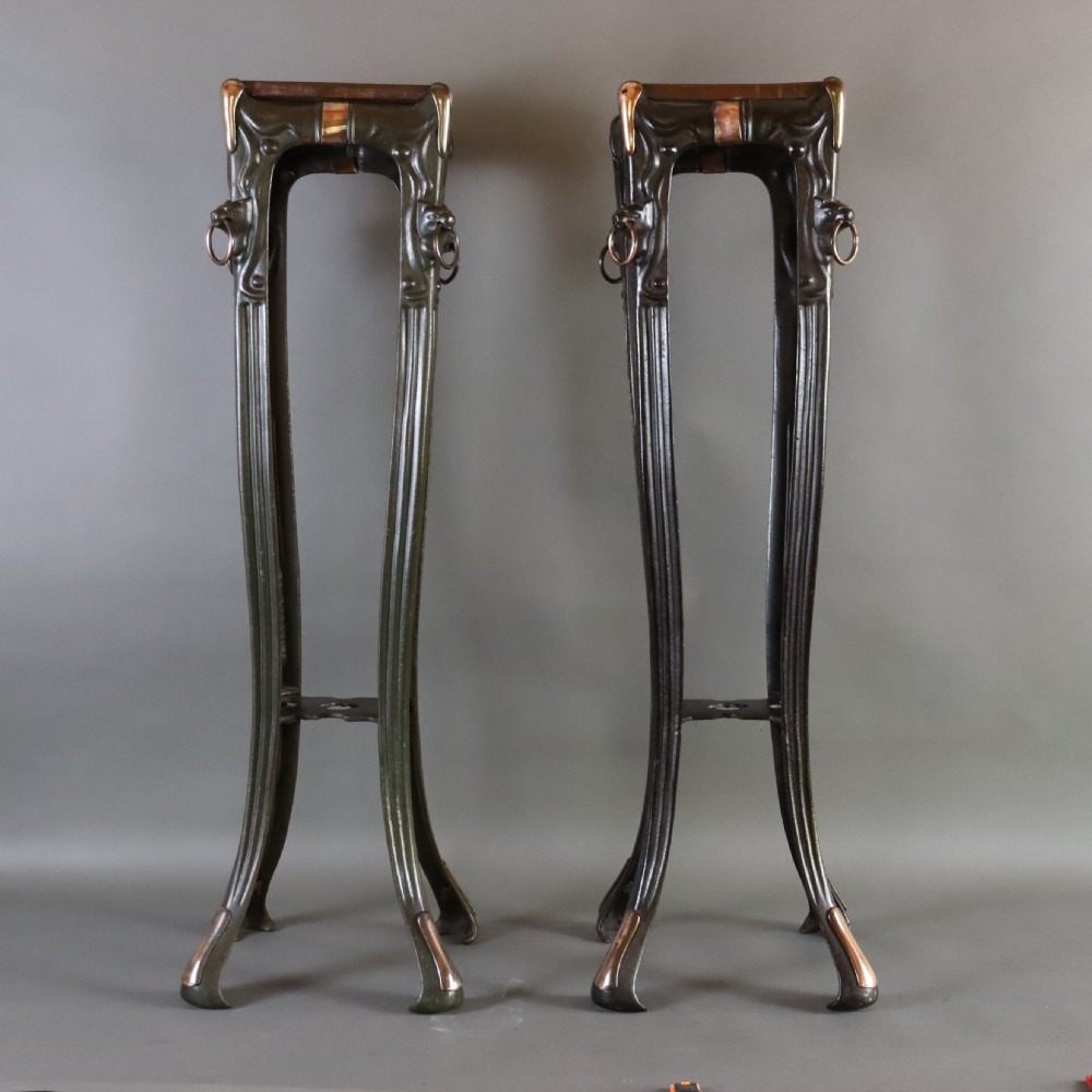 Pair of Art Nouveau cast iron torchère or jardinière stand 